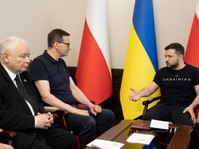 Ukraine's President Volodymyr Zelenskiy speaks with Polish Prime Minister Mateusz Morawiecki and Polish Vice Prime Minister Jaroslaw Kaczynski during their meeting, as Russia's attack on Ukraine continues, in Kyiv, Ukraine June 1, 2022.