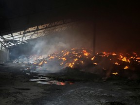 Seeds burn in a grain silos after it was shelled repeatedly, amid Russia's invasion of Ukraine, in Donetsk region. The crisis in Ukraine is one of a series of threats facing the world’s food systems.