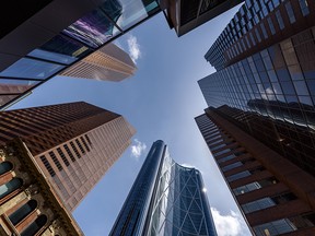 A worm's-eye view of office buildings on a sunny day in downtown Calgary.