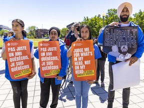 Members of the World Sikh Organization of Canada took part in a protest to mark the third anniversary of Bill 21, the Quebec government's legislation banning religious symbols for civil servants in Montreal on Saturday, June 11, 2022.