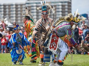 Dancers perform during a powwow to celebrate Canada Day at Fort Calgary on Friday, July 1, 2022.