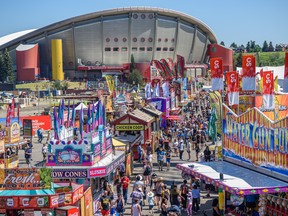 People enjoy a hot, sunny afternoon on the Stampede grounds on Friday, July 15, 2022.