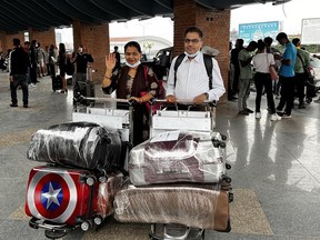Deena Giri's parents, Jeevan and Sangita, arrived at the Calgary International Airport on June 26 from Kathmandu, Nepal, to visit her in Red Deer for two months, however, their luggage  (pictured here earlier in the trip) did not arrive with them and has been lost for more than 20 days.