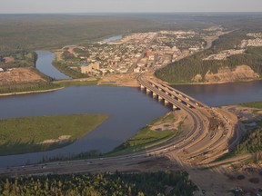 An aerial view of the city of Fort McMurray, Alta. with the Athabasca River Bridge in the foreground and the Clearwater River in the background on June 20, 2013.
