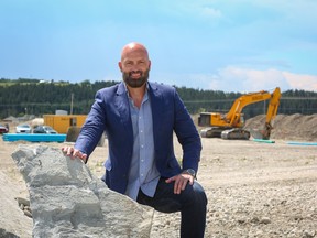 Josh Hagen, president and CEO of General Development Services, stands with the developing Greystone community behind him. The grand opening for the new community is slated for spring of 2023.