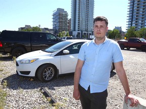 Albert Bronskyi, a recent arrival from Ukraine, poses in East Village near downtown Calgary on Tuesday, July 12, 2022.