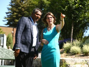 Alberta Transportation Minister Prasad Panda chats with Okotoks Mayor Tanya Thorn in Okotoks, south of Calgary on Wednesday, July 20, 2022. The town of Okotoks received a provincial water for life grant and the $16 million in funding will be used to construct a real water pipeline. Jim Wells/Postmedia