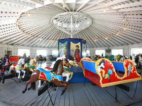 Visitors ride the Bowness Carousel at Heritage Park in Calgary on Saturday, July 23, 2022. The classical ride was donated by the City of Calgary in 1969 and will now be featured on a stamp.