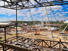 The Calgary Stampede midway is seen from the BMO Centre expansion construction site on Sunday, July 17, 2022. Construction resulted in a more congested midway area which should be resolved by the 2024 Calgary Stampede.