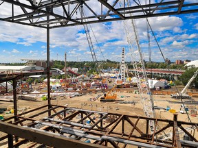 The Calgary Stampede midway is seen from the BMO Center expansion construction site on Sunday, July 17, 2022. Construction resulted in a more congested midway area that should be resolved by the 2024 Calgary Stampede.