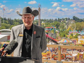 Calgary Stampede CEO Joel Cowley speaks about this year’s Stampede from the BMO Centre expansion construction site with the midway as a backdrop on Sunday, July 17, 2022.