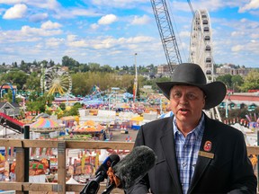 Calgary Stampede President and Chairman of the Board Steve McDonough speaks about this year's Stampede from the BMO Center expansion construction site against the backdrop of the media on Sunday, July 17, 2022.