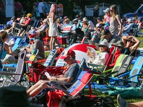 Crowds fill the grass in front of the main stage for the opening night of the Calgary Folk Music Festival on Thursday, July 21, 2022.