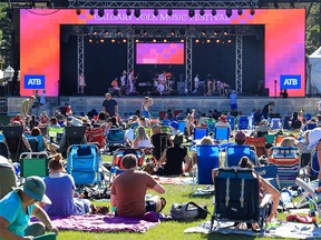 The audience watches Xenia Franca on the main stage during the opening night of the Calgary Folk Music Festival on Thursday, July 21, 2022.