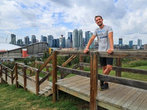 German cyclist Darius Braun was photographed with the Calgary skyline in the background on Monday, July 25, 2022. Braunon overcame paralysis due to a brain tumour surgery and is planning to cycle 20,000 km from Calgary to Ushuaia, Argentina, to raise awareness and funds for brain tumour research. However, on the flights to Calgary, his luggage with all of his trail supplies and bike was lost. He needs to either replace it all or wait for the luggage to be found.