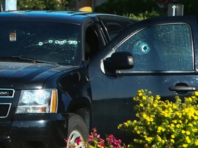 A vehicle with bullet holes visible on the windshield is seen after multiple shootings targeting transient victims in the Vancouver suburb of Langley on Monday.