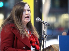 FILE PHOTO: Inna Platonova, President of the Ukrainian Canadian Congress Calgary Branch, joins members of the Ukrainian community for a flag rising ceremony outside the McDougall Centre. Friday, February 25, 2022.