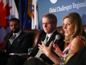 L-R Victor Thomas, President and CEO Canada India Business Council, Tyler McCann, Managing Director Canadian Agri-Food Policy Institute and Angela Marshall Hofmann, VP International Trade and Supply Chain Resiliency ST&R Sandler, Travis & Rosenberg, P.A. speak at a panel discussion at the PNWER 2022 Summit in Calgary on Tuesday, July 26, 2022.