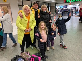 The Masalov family arrive in Calgary on April 19 after fleeing the conflict in Ukraine. Back, left to right: Larysa, Artem and Kateryna. Front, left to right: Stefaniia, 5, Hlafira, 2, and Stepa, 7. On Friday they'll be taking in their first Calgary Stampede parade.