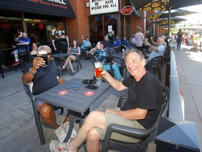 Patrons relax on the patio of Side Street Pub and Grill in Kensington on June 1, 2021.