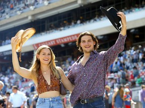 LR, Janelle Hanson and Ben Foster cheer on a successful Calgary Stampede 2022 on Wednesday, July 13, 2022.
