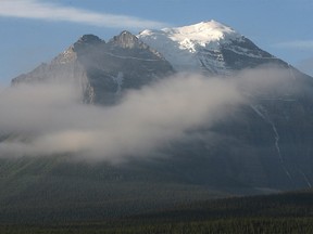 FILE PHOTO: The morning sun glitters on the snowcap of the imposing hulk of Mount Temple on Sunday, September 2, 2007.