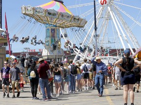 Large crowds have added long wait times for rides and food at the Calgary Stampede in Calgary on Monday, July 11, 2022.