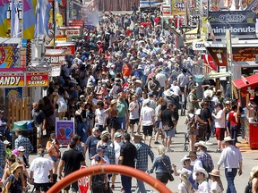 Large crowds have added long wait times for rides and food at the Calgary Stampede in Calgary on Monday, July 11, 2022.