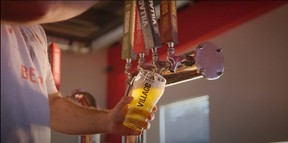 John Montgomery checks out drinkers at Calgary's Village Brewery on his cross-Canada trek to explore the country's beer culture.