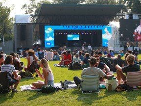 Music fans take in the first night of the Calgary Folk Music Festival's Summer Serenades Concert Series at Prince's Island on Thursday, July 22, 2021.