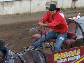 Kurt Bensmiller drives to the finish line in the Cowboys Rangeland Derby at the Calgary Stampede on Saturday.