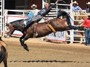 Manitoba cowboy Orin Larsen rode Disco Party to the top score of 87 during Wildcard Saturday bareback riding competition at the Calgary Stampede rodeo.