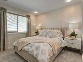 The master bedroom in the Indigo show home by Homes by Avi in Savanna in Saddle Ridge.