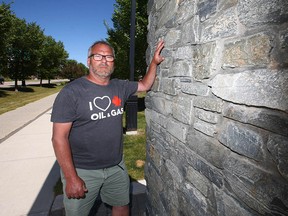 Garry Moyes at the location on Victoria Cross Blvd. S.W. in the community of Currie Barracks where plaques honouring Victoria Cross recipients were recently stolen.