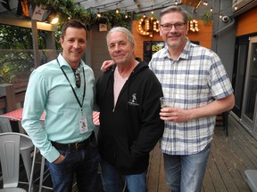 Famed wrestler Bret Hart, centre, was the honorary Brew Master at the 10th Annual Nut Ale Fundraiser on July 7 at Bottlescrew Bill's Pub and Buzzards in support of the Calgary Prostate Centre (PCC). Pictured with Hart is PCC's new CEO Jeff Davison, left, and Village Brewery co-founder Tom Stuart. Photos, Bill Brooks