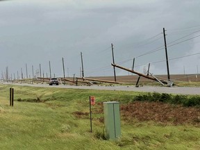 Power lines cross Box Springs Road north of Medicine Hat after a storm hit the area on Monday, July 18, 2022.