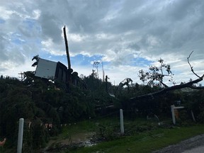 Photos show the destruction caused by a suspected tornado on Township Road 320, about 13 kilometres west of Olds.