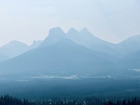 FILE PHOTO: A thick smoky sky outline of the Three Sisters mountains on July 29, 2021.