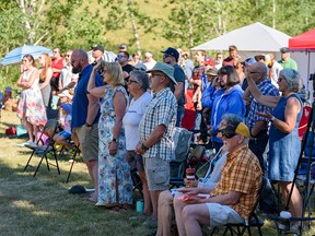 Sunday service at Bonavista Church is held in the green space across the street after the church was damaged by fire, which occurred early Friday, Sunday August 14, 2022.