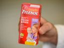 Pharmacy owner Ali Zgheib holds a box of children's Tylenol at Pharmacy Care on Thursday, August 18, 2022.