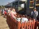 People wait to board the steam train at Heritage Park in Calgary on Monday, August 22, 2022. 