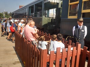 People wait to board the steam train at Heritage Park in Calgary on Monday August 22, 2022.