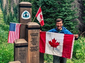 Former Calgary city councillor Jeromy Farkas stands at the northern end of the Pacific Crest Trail after finishing his fundraising hike.