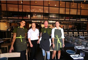 Chef Adam Ryan, with staff Jacinta Correct, Natasha Krahn and Jacqueline Mudd at Fire and Flora at the District at Beltline. Jim Wells/Postmedia