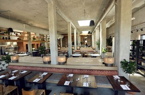 The large open dining room is lined with plants and decorations in Fortuna's Row. Jim Wells/Postmedia