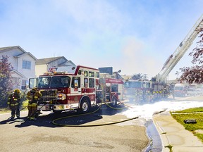 Firefighters arrive on scene to suppress a fire in the neighbourhood of Martindale in Calgary on Sunday, August 7, 2022.