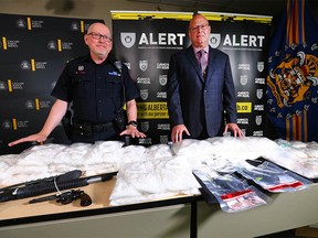 Calgary Police Supt. Scott Boyd (L) and CPS Staff Sgt. Shawn Wallace pose in Calgary at Calgary Police Headquarters on Thursday, August 11, 2022.
Nearly $3 million dollars’ worth of methamphetamine and fentanyl were seized in a pair of ALERT investigations in Calgary. Two investigations by ALERT’s Calgary organized crime team, which both concluded just days apart, have yielded substantial seizures of fentanyl and methamphetamine. In addition to the drugs, ALERT seized four firearms and arrested five suspects.