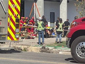 Calgary fire crews, including the CFD technical rescue team, work at the scene of a construction site at the 2900 block of 17 Ave. S.W. for reports of a workplace accident. The 911 call indicated that a construction worker had fallen down a concrete shaft at least 25 feet below street level and sustained significant injuries as a result.