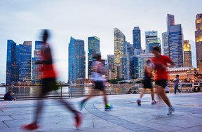 Men running in the evening in Singapore. Files