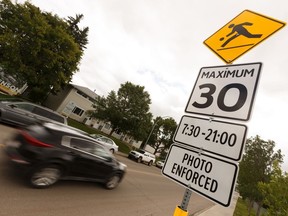 A playground zone with a sign warning of photo radar enforcement, along 96 Street between 66 avenue and 68 Avenue near Hazeldean School in Edmonton.